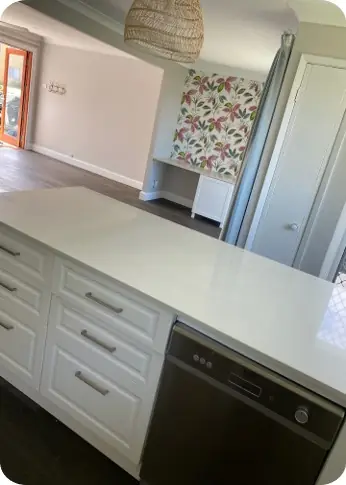 The Entrance — finished kitchen with blue-tiled island